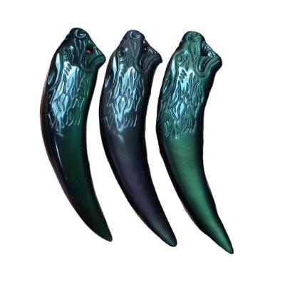 China Feng Shui Wholesale Beautiful Natural Rainbow Eye Obsidian Wolf Tooth Skulls Crystal Pendant For Pendant for sale