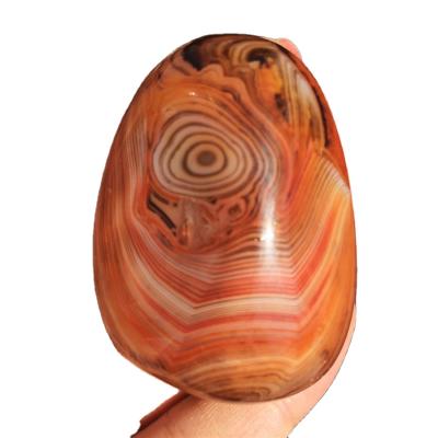 China Feng Shui Stone Carving Natural Polished Tumbled Crystal Agate Pebble Sardonyx Palm for Decoration for sale