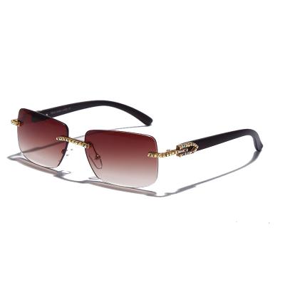 China Custom Rimless Trendy Sunglasses 2021 Women Sun Glass Shade Frame Hot Selling Amazon Fashion Sun Glasses Small Frame for sale