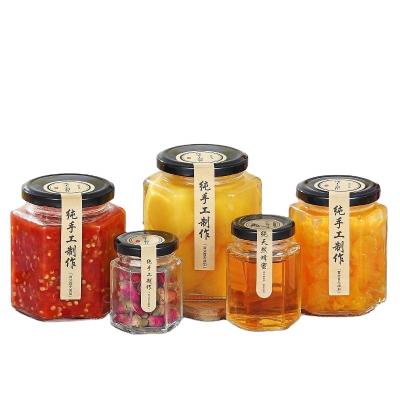 China Viable Factory Direct Glass Hexagon Food Storage Container Honey Jar 100ml 180ml 280ml 380ml 730ml for sale