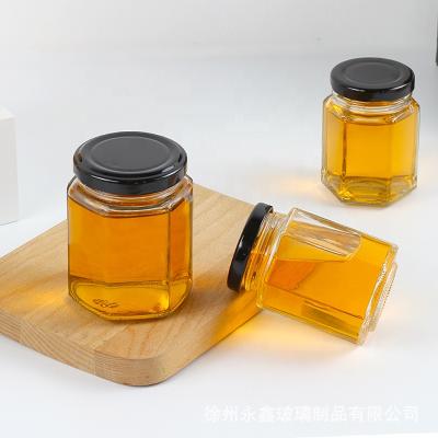 China Viable Luxury Jars 500g Honey Glass Jar Hexagonal Honey Pot Jar for sale