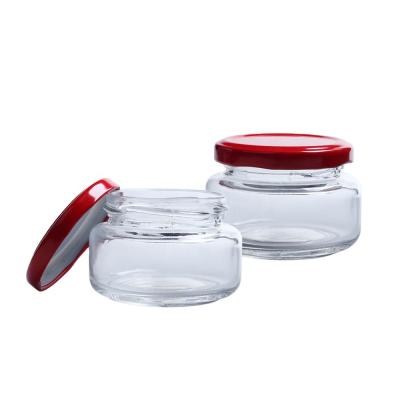 China Sustainable Wide Mouth 30ml Flat Round Bottle Glass Jam Jar Tea Coffee Sugar Salt Storage Jar With Metal Lid for sale