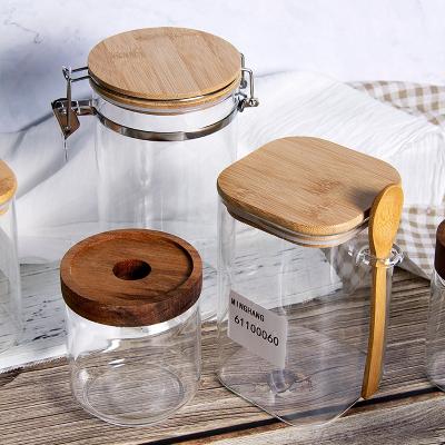 China Borosilicate Wooden Top Storage Screw Cap Glass Jar Viable Food Glass Jar for sale