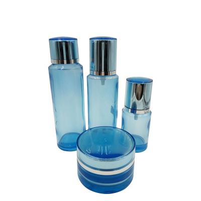 China Shape High Quality Skin Care Personal Care Color Lotion Glass Cosmetic Bottle With UV Plastic Cap for sale