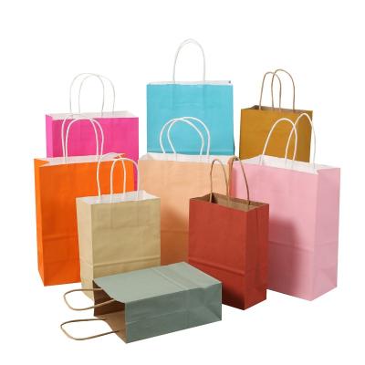 China Recycled Materials Spot Wholesale Recycled Custom Logo Brown Paper Package Food Wrap Paper Clothing Shoe Gift Shopping Bags With Handles for sale