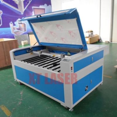 China Hot selling water cooled engraving and CO2 laser cutting machine for wood acrylic leather rupper for sale