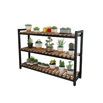 China Chinese wooden balcony flower ray storage movable solid wood rack (the other) adjustable iron for sale