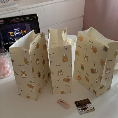 China Simple Colorful Paper Cartoon Cooking Bear Storage Gift Paper Packaging Bag for sale