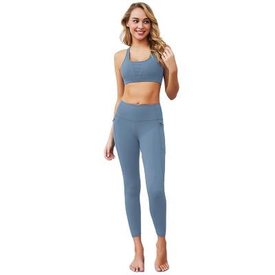 China New Pockets Breathable Suits Hip Fitness Sports Suits Women Two Piece 2021 Ladies Yoga Sets for sale