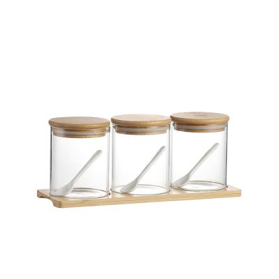 China Eco-friendly recyclable high borosilicate glass food sealed storage jar with bamboo lid for storing coffee beans, snacks, beans, salt, nuts and candy for sale