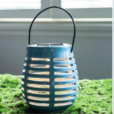 China 10.5*12c mcamping table light  blue ceramics lantern  with 1L warm white led with solar panel light garden for home disco lights for sale