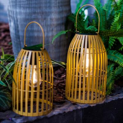 China Newish outdoor garden imitation bamboo solar metal lantern with plastic filament bulb and solar panel for sale