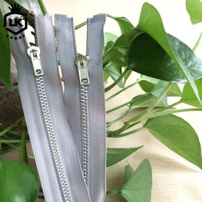 China Viable Custom Logo Aluminum Teeth Long Chain Bags Packaging Zipper #4 #5 Zipper Roll for sale