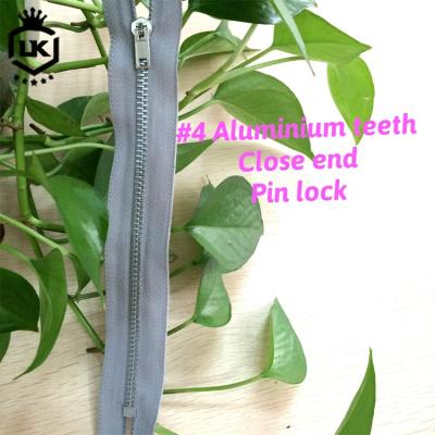 China Viable Custom Logo Teeth Zipper#4 #5 Long Chain Zipper Roll Jogging Suit Zipper Aluminum for sale