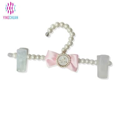 China Wholesale Eco-friendly White Plastic Pearl Hanger Fashion Hanger Pearl Pants Hanger for sale