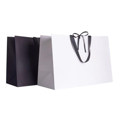 China Recyclable Large Paper Wedding Dress Packaging Gift Mailing Bag for sale