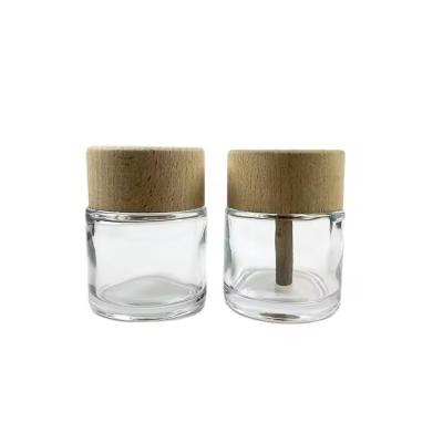 China 50ml Clear Glass Diffuser Bottles with Wooden Cap Perfume Luxpry Glass Bottles for sale