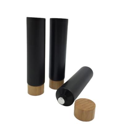 China 200ml Aluminum Cosmetic Soft Tube Packaging For Cosmetics Bamboo Lid 40/400 40MM for sale