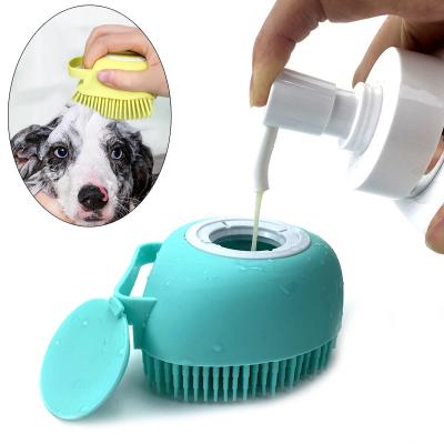 China Soft Stocked Pet Bath Brush Comb Silicone Dog Hair Fur Grooming Cleaning Brush Shampoo Dispenser for sale