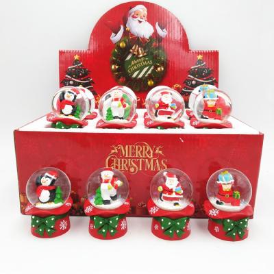 China Europe 45mm Christmas Snow Globe Decoration Resin Snowball Glass Snow Globe for sale