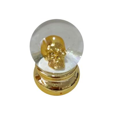 China Europe Halloween Head Snow Globe Glass Ball With Gold eletrocplated Resin Base for sale