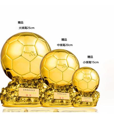 China Popular non-profit organizations gold ball boot football trophy winner cup gold resin open ball gold trophies for sale