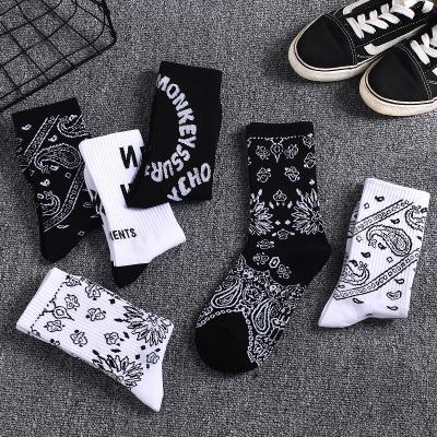 China Breathable sportswear lugs men and women lovers autumn winter totem calf the new lugs tidal brand hip hop tube cottonSports long socks for sale