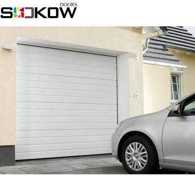 China Single and double track steel track with corner nylon security garage steel insulated sectional door with pedestrian gate for sale