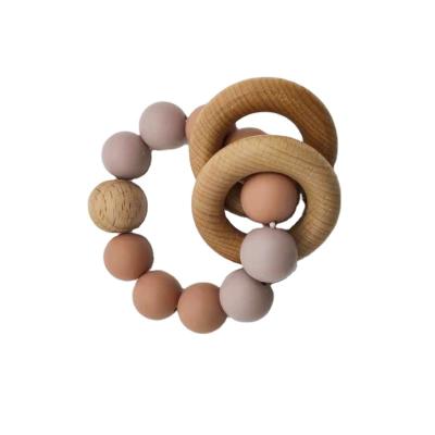 China Custom Eco Friendly Silicone Beads Toys Silicone Baby Teether With 2 Wooden Strap for sale