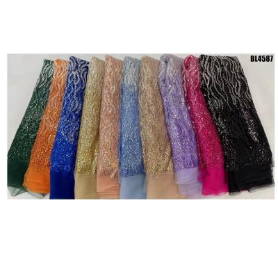 China Luxury african french tulle lace  handmade beaded bridal voile lace fabric Bead Embroidery Lace for dress for sale