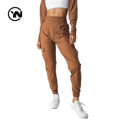 China Custom Anti-Wrinkle High Waisted Fashion Woman Track Jogger Nylon Cargo Pants With Side Pockets Women for sale