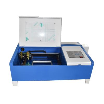 China Laser Engraving 320 Mobile CO2 40W Laser Cutter Screen Laser Engraving Machine For Phones Phone Protector Laser_engraving_machine_mini for sale