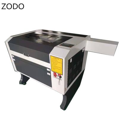 China Laser Engraving Auto Focus Laser Cutting Machine CO2 6040 100W Blowing Acrylic Wood Cutter Lazer For Acrylic MDF for sale