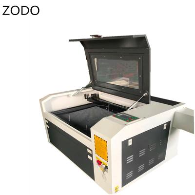 China Laser Engraving Liaocheng 6040 Laser Engraving Wood Cutting Machine 60W Pen Laser Engraver CO2 Laser Cutter With WIFI USB Port Ruida Controller for sale