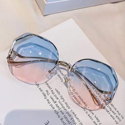 China Women's Personality Retro Curved Mirror Leg Sunglasses Cut Out Rimless Fashion Sun Glasses Polygon Sunglasses for sale