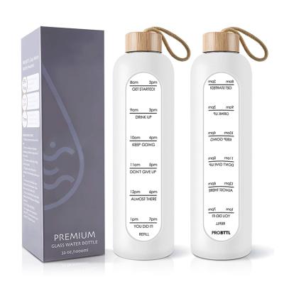 China Sustainable Custom Logo Silicone Sleeve 500ml Clear Container With Metal Bamboo Lid Drinking Borosilicate Glass Frosted Water Bottle 1000ml for sale