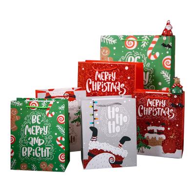 China Recycled Materials Low MOQ Free Sample Drawstring Christmas Paper Custom Printing Gift Bags 3d With Your Own Logo for sale