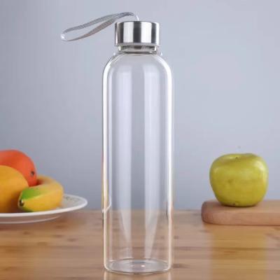 China Viable Glass Water Bottle With Bamboo Lid Crystal Stone Designer Glass Water Bottle for sale