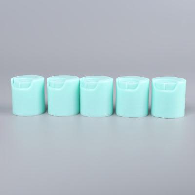 China Non Spill Mini Cap Green Color Plastic Disc Top Cap For Shampoo Bottle for sale