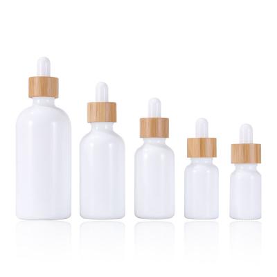 China Personal Care 10ml Porcelain White Bottles With Bamboo 100ml 50ml Essential Oil Dropper Bottle 30ml Glass Bottles for sale