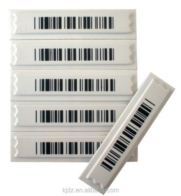 China EAS barcode security tag 3 chips soft barcode adhesive 58khz/white/black am dr.label for supermarke for sale