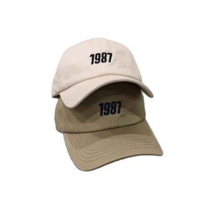 China 1987 Universal Hat Peaked Four Seasons COMMON Letter Embroidered Baseball Cap Sports Soft Casual Trend Cap for sale