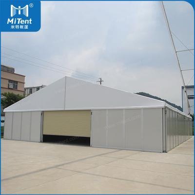 China Indoor Waterproof Asian Sandwich Wall Storage Warehouse Tent With Wooden Floor System for sale