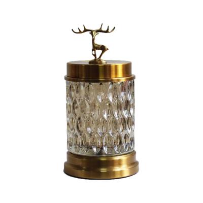 China Sustainable Luxury Metal Gold Lid Deer Glass Candy Jar for sale