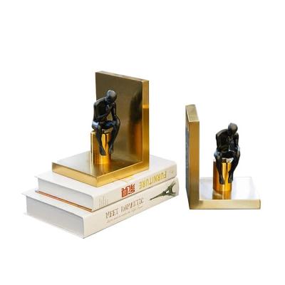 China Art Black Modern Creative Resin Metal Iron Gold Sculpture Adjustable Decorative Bookends for sale