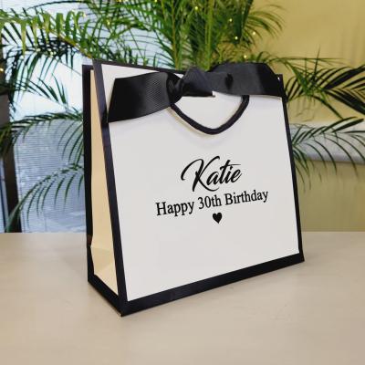 China Luxury Reused White Paper Bags Logo Print Shopping Handbag Craft Customized Recyclable Wholesaler Paper Bag Printing Shop With Handle for sale