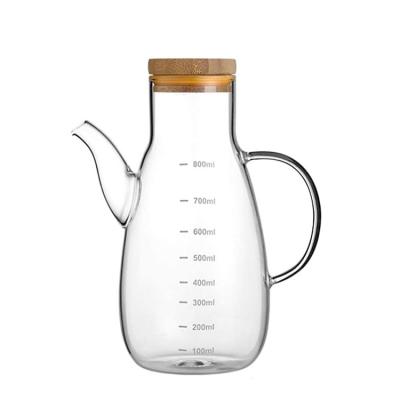 China 500ml 800ml Food Grade Heatable Wholesale Kitchen Glass Non-slip Handle Oil Jar Dispenser for sale