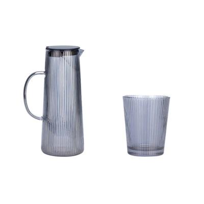 China Sustainable High Borosilicate Glass Water Cooling Vertical Grain Jug With Colored Handle And Plastic Cover For Water Juice for sale