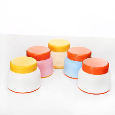 China New Design 50g 100g Cute Empty Pink Frosted Plastic Cosmetic Jars Double Wall PP Face Cream Cosmetic Jars for sale