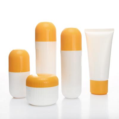 China 2021 Cosmetic Cute Cream PP Shape Jar 50g White Lotion Bottle With Yellow Cap 60ml 120ml 180ml for sale